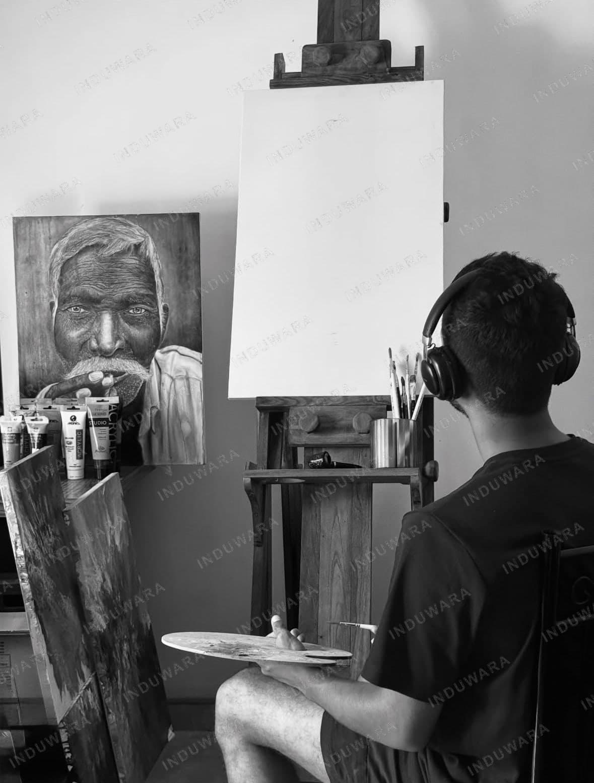 Induwara at work in the studio